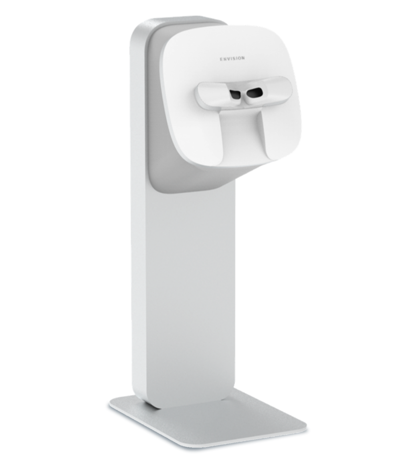 Envision Diagnostics' eye scanner.  It is a metallic white color and resembles a large bookend that has an extruding portion at the top for users to look through. 
